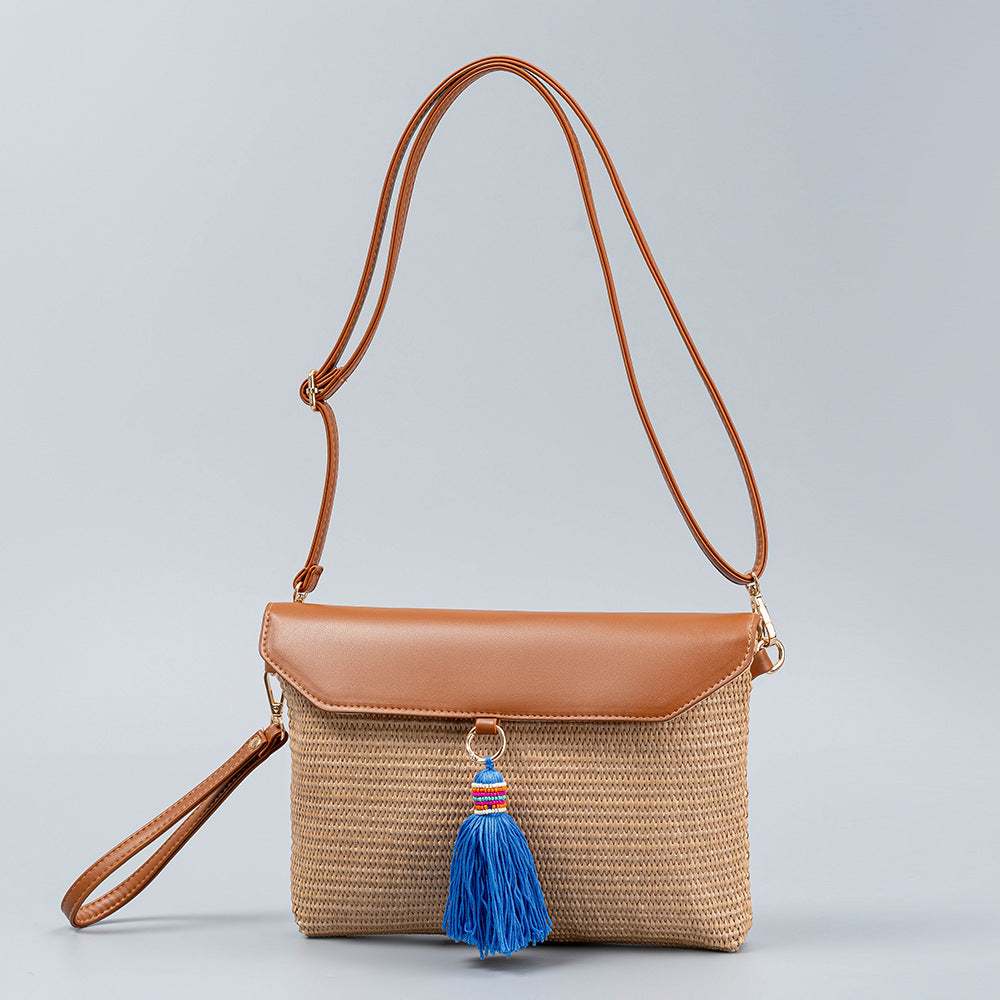 Bolso de hombro de paja tejido con borla