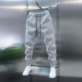 Pantalones casuales de corte holgado a rayas