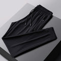 Pantalones deportivos transpirables elásticos de secado rápido