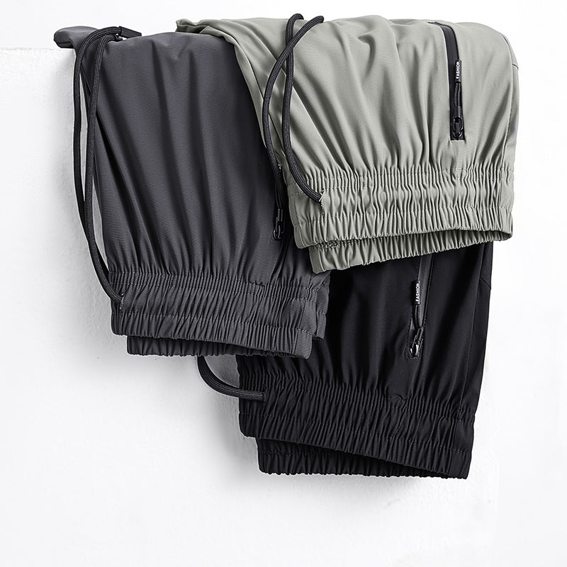 Pantalones deportivos transpirables elásticos de secado rápido